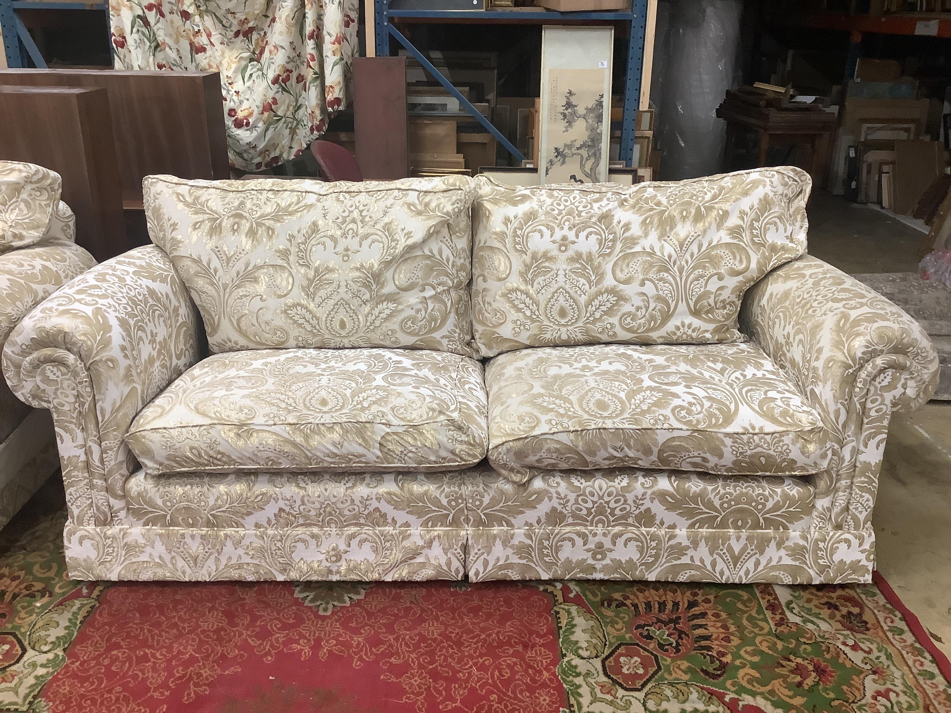 Two Duresta two seat sofas and a matching rectangular footstool, larger sofa width 220cm, depth 96cm, height 96cm